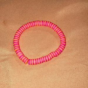 I am selling a bracelet and is pink and orange and is average size .enjoy!!